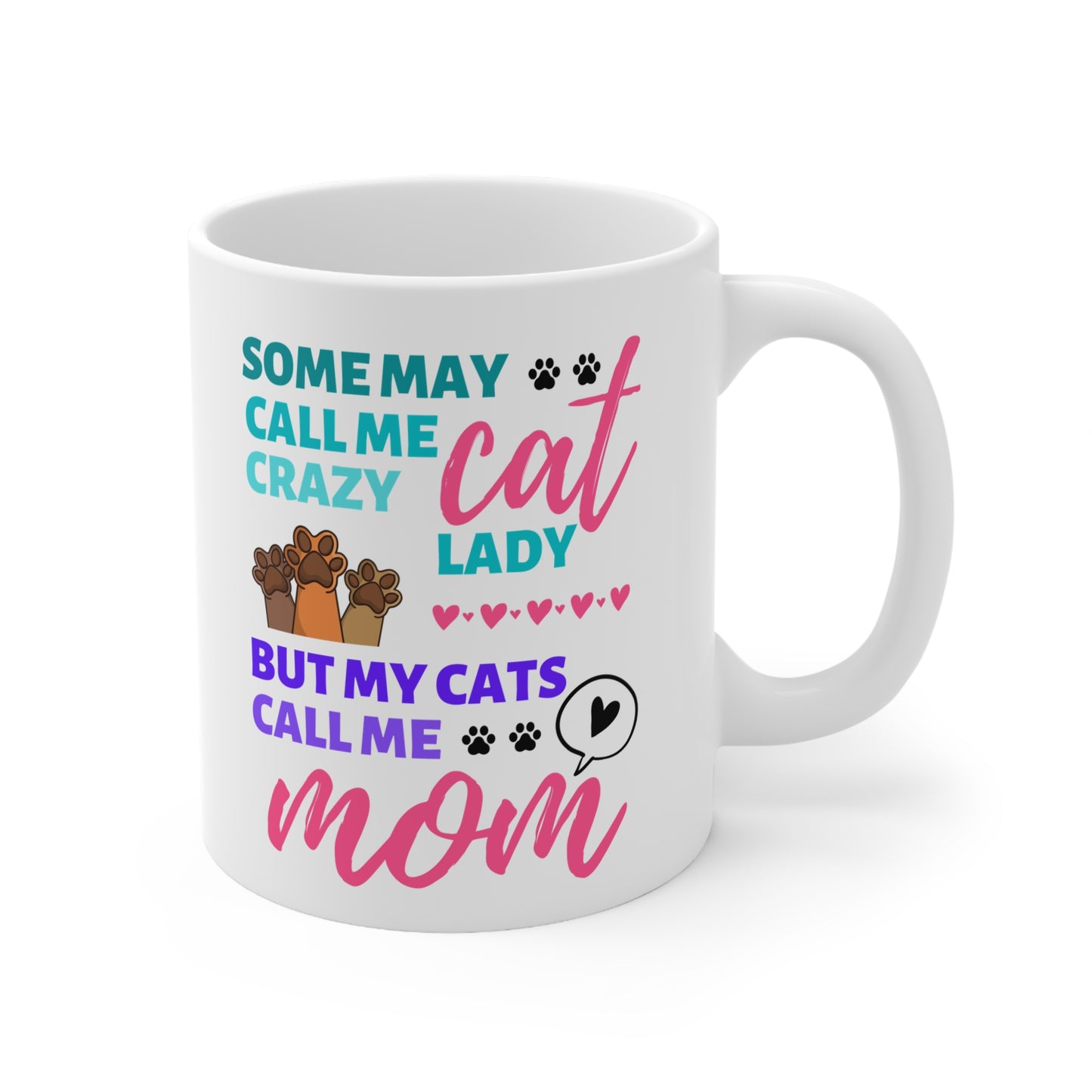White mug with colorful text and cat illustrations on a white background