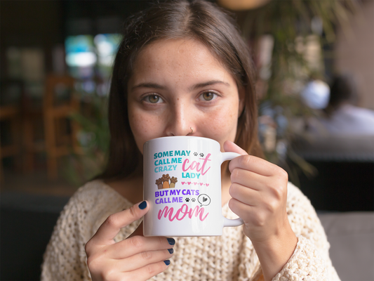 Woman holding a mug with text in a casual setting