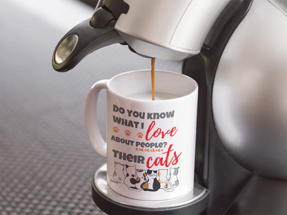 Coffee being poured into a mug with a humorous cat-themed message.